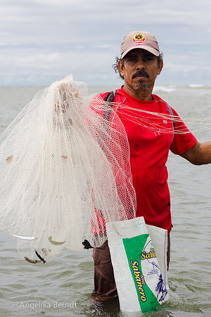 Fisherman fishing at the Pacific coast in Costa Rica