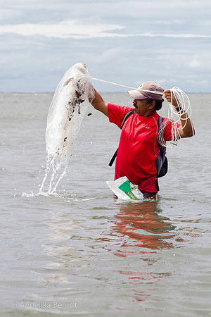 Fisherman fishing at the Pacific coast in Costa Rica